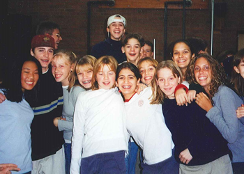 Middle school students in the 1990s smiling for the camera
